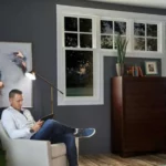 man sitting in front of custom windows